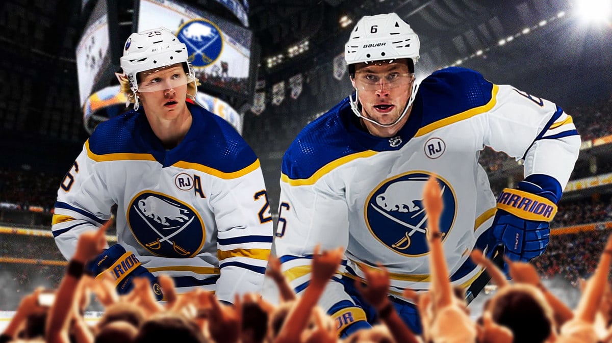 Buffalo Sabres defenseman Rasmus Dahlin being praised by teammate Erik Johnson after scoring three points against the Chicago Blackhawks