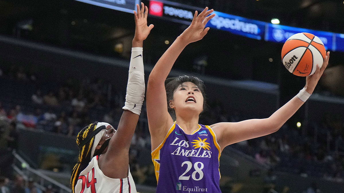 LA Sparks center Li Yueru (28) shoots the ball against Washington Mystics forward Aaliyah Edwards (24) in the first half at Crypto.com Arena.