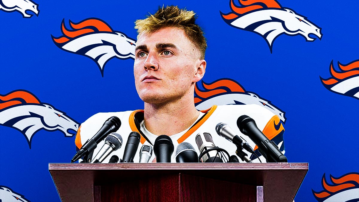 Bo Nix at a podium with Denver Broncos logo behind him