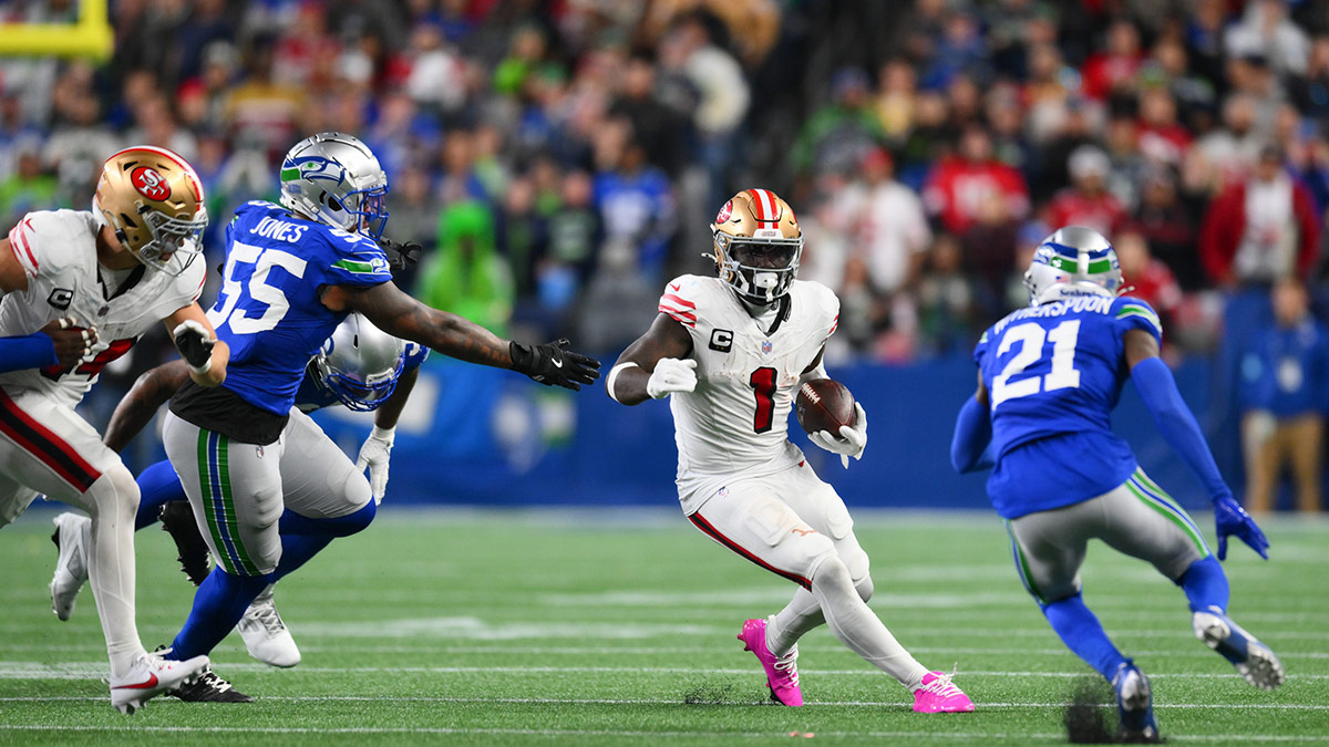 San Francisco 49ers wide receiver Deebo Samuel Sr. (1) carries the ball against the Seattle Seahawks during the second half at Lumen Field.