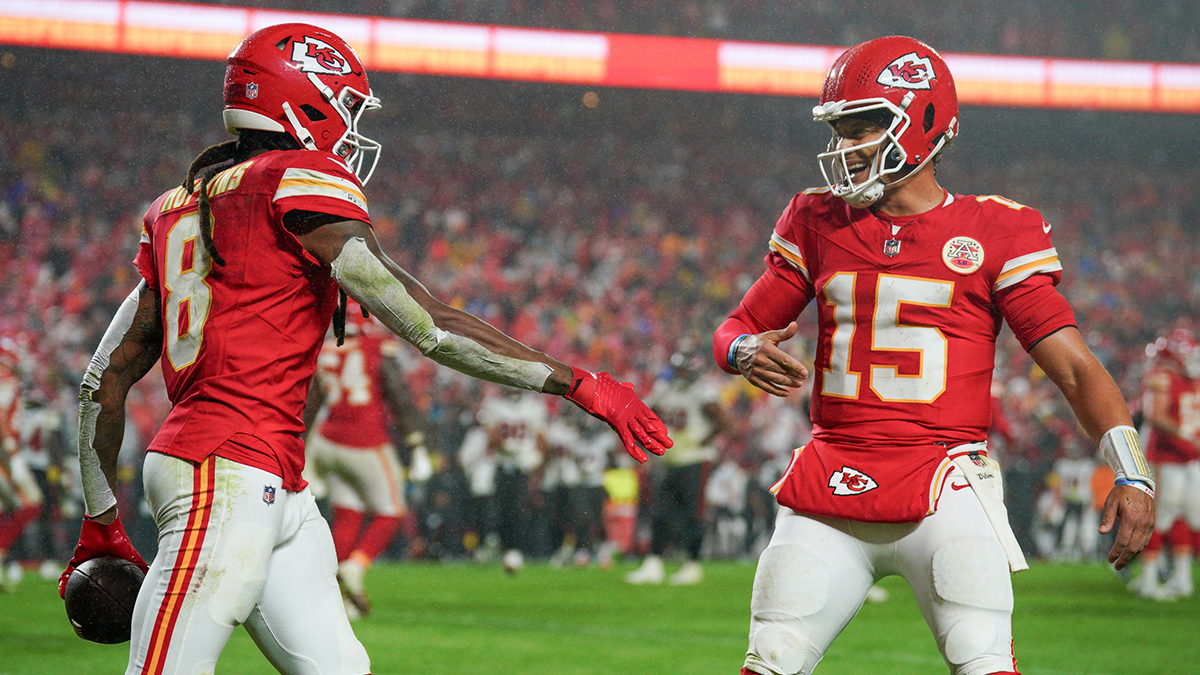 Kansas City Chiefs wide receiver DeAndre Hopkins (8) celebrates with quarterback Patrick Mahomes (15) after scoring against the Tampa Bay Buccaneers during the second half at GEHA Field at Arrowhead Stadium.