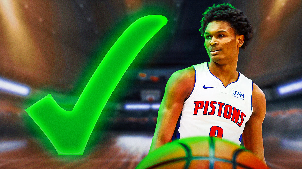 Detroit Pistons guard Ausar Thompson smiling, with a green checkmark next to him.