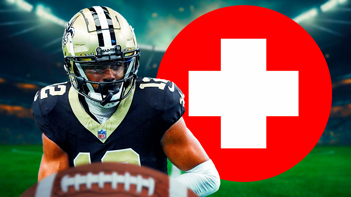 Saints WR Chris Olave with medical Red Cross symbol