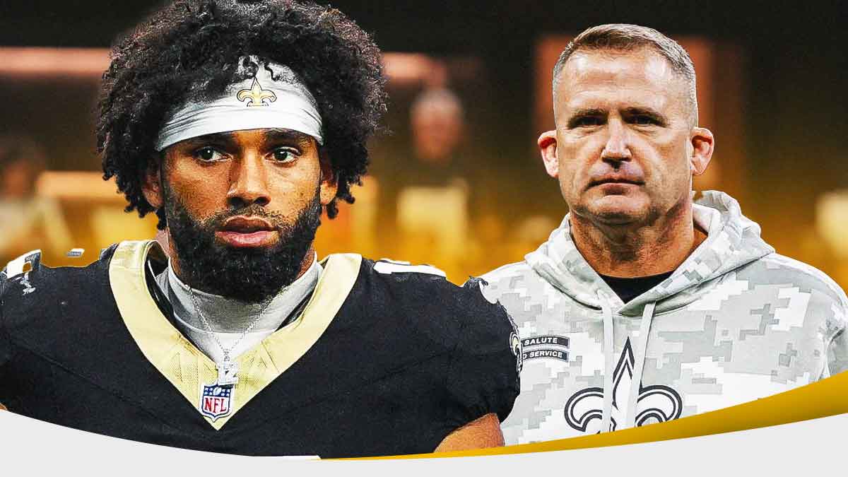 Chris Olave in a New Orleans Saints uniform with Saints coach Darren Rizzi as Rizzi provided an update on Olave's injury.