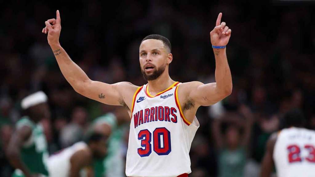 Warriors guard Stephen Curry (30) celebrates during the second half against the Boston Celtics at TD Garden