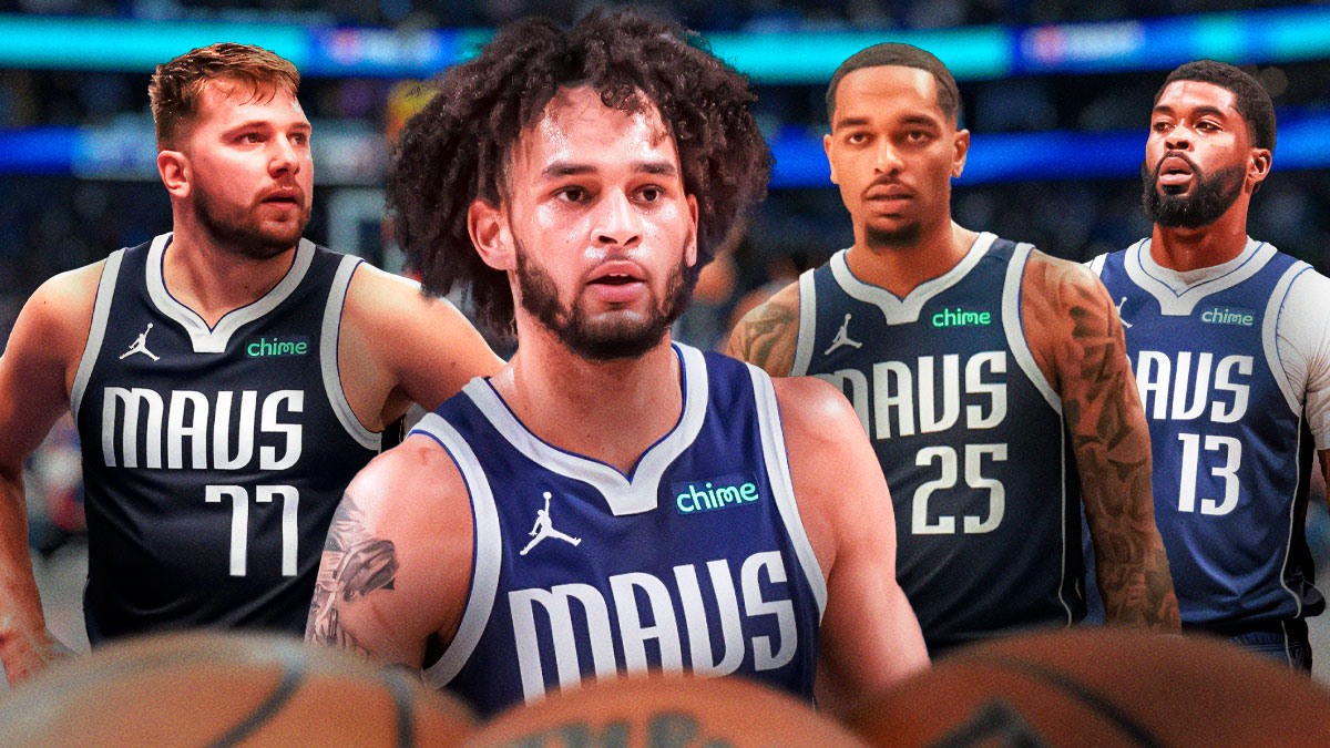 Mavericks Dereck Lively II in front looking serious. Mavericks Luka Doncic, Mavericks Naji Marshall and Mavericks PJ Washington all in background looking serious.