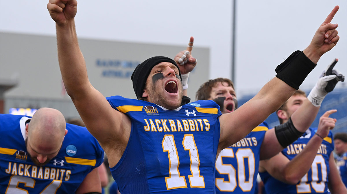 FCS South Dakota State quarterback Mark Gronowski (11) cheers after entering the transfer portal and singing the victory song on Saturday, Dec. 14, 2024, at Dana J. Dykhouse Stadium in Brookings.