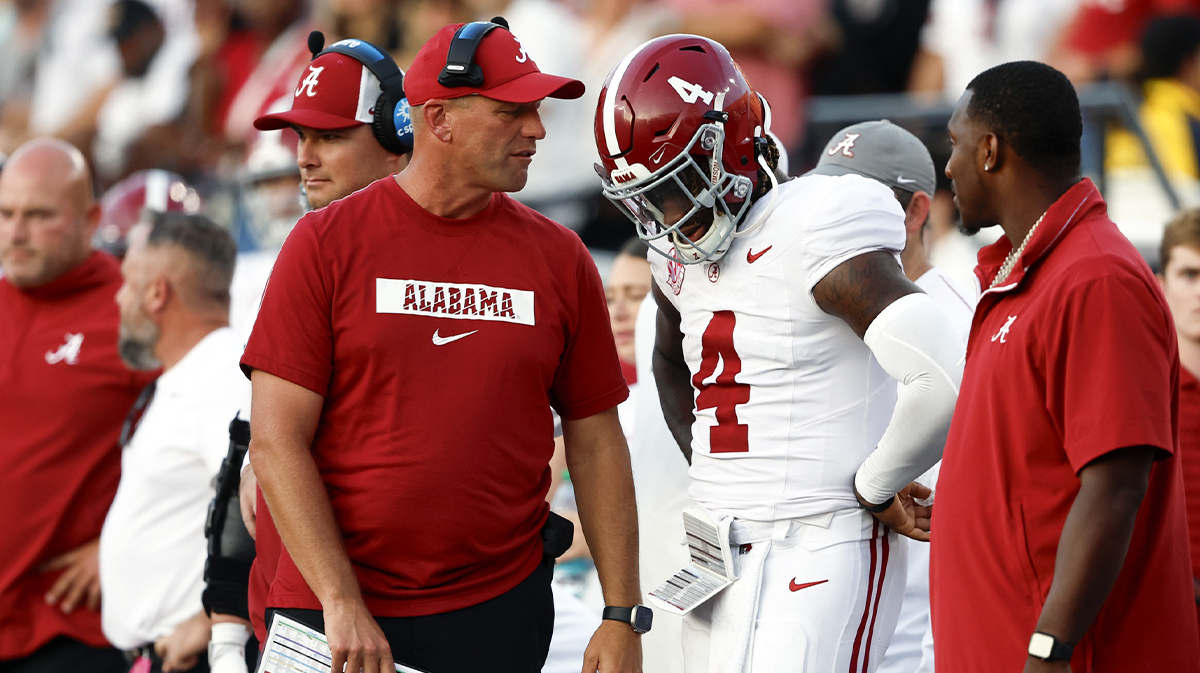 Alabama Crimson Tide head coach Kalen DeBoer talks with quarterback Jalen Milroe (4) during the second half against the Vanderbilt Commodores at FirstBank Stadium.