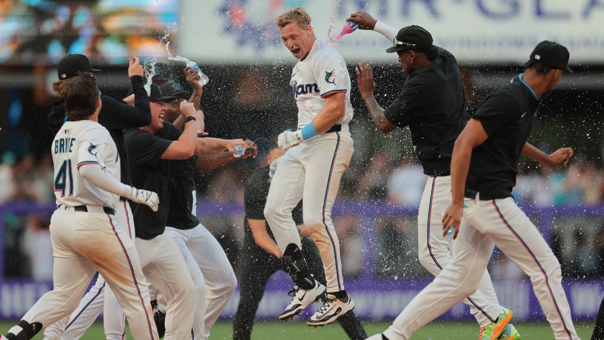 Miami Marlins left fielder Kyle Stowers (28) celebrates with teammates after hitting a walk-off single against the Pittsburgh Pirates during the ninth inning at loanDepot Park.