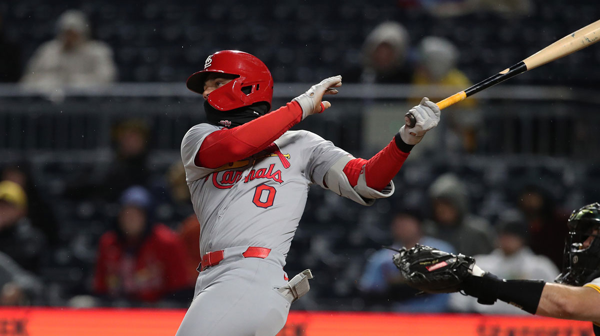 Apr 7, 2025; Pittsburgh, Pennsylvania, USA; St. Louis Cardinals shortstop Masyn Winn (0) hits a solo home run against the Pittsburgh Pirates during the ninth inning at PNC Park. Mandatory Credit: Charles LeClaire-Imagn Images