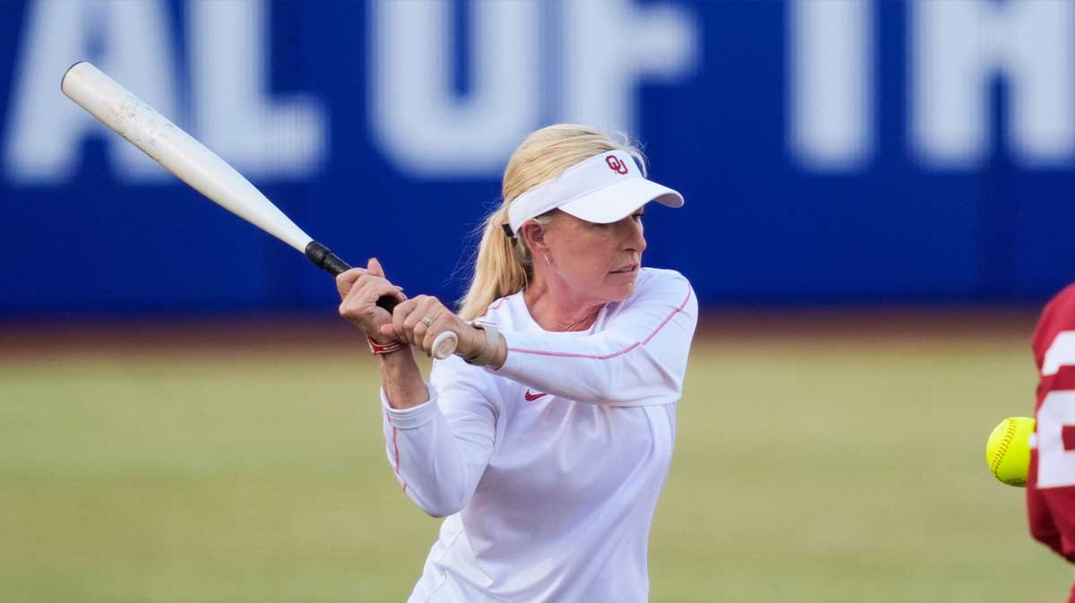 Oklahoma coach Patty Gasso runs drills with her team before a college Bedlam softball game between the University of Oklahoma Sooners (OU) and the Oklahoma State University Cowgirls (OSU) at Devon Park in Oklahoma City, Wednesday, April 9, 2025.