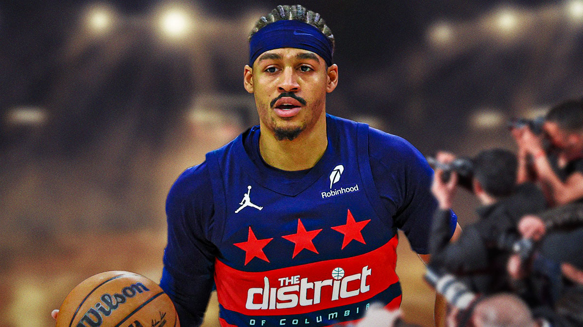 Jordan Poole dribbles