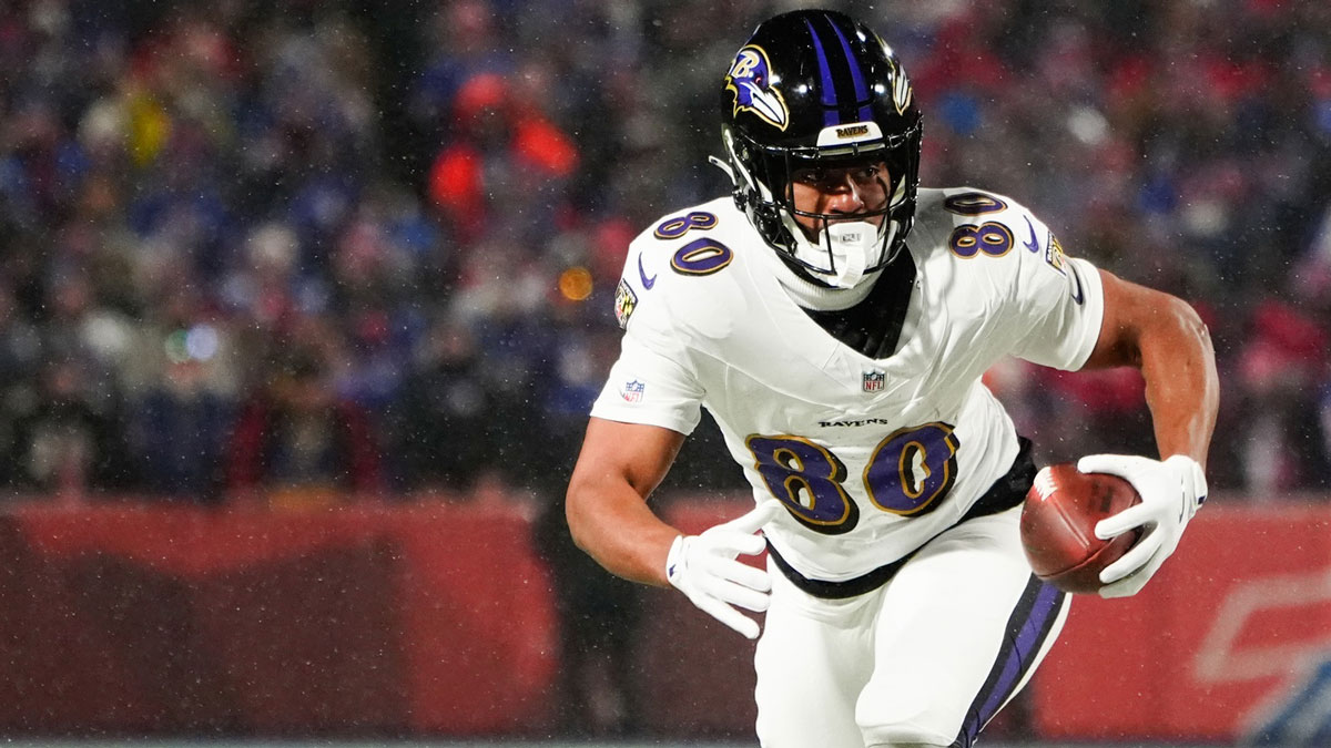 Baltimore Ravens tight end Isaiah Likely (80) runs the ball after making a catch during the first quarter against the Buffalo Bills in a 2025 AFC divisional round game at Highmark Stadium.
