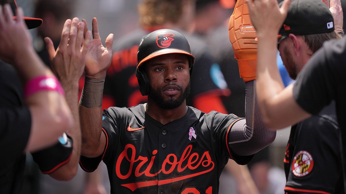May 11, 2025; Anaheim, California, USA; Baltimore Orioles center fielder Cedric Mullins (31) is congratulated by teammates after scoring in the fifth inning against the Los Angeles Angels at Angel Stadium.