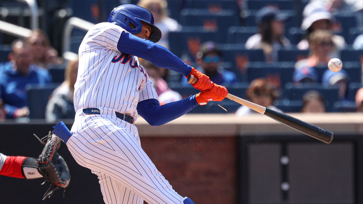 New York Mets right fielder Juan Soto (22) hits an RBI sacrifice fly during the third inning against the St. Louis Cardinals.
