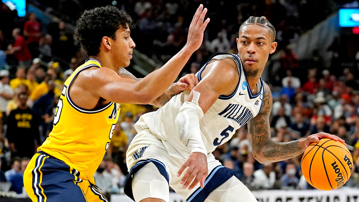 Villanova Wildcats guard Justin Moore (5) drives to the basket against Michigan Wolverines guard Eli Brooks (55) in the semifinals of the South regional of the men's college basketball NCAA Tournament at AT&T Center.