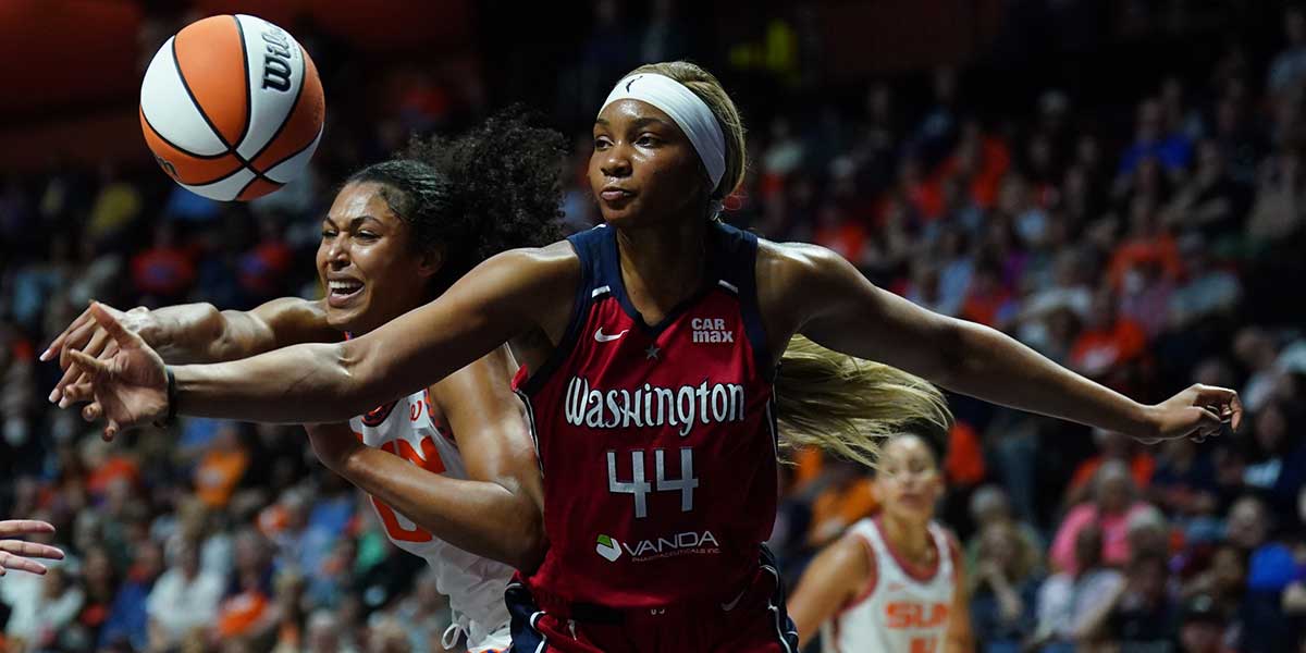 Connecticut Sun forward Olivia Nelson-Ododa (10) works for the rebound against Washington Mystics forward Kiki Iriafen (44) in the second half at Mohegan Sun Arena.