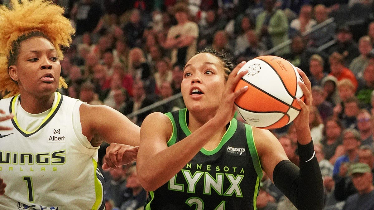 Minnesota Lynx forward Napheesa Collier (24) drives to the basket against Dallas Wings forward NaLyssa Smith (1) in the fourth quarter at Target Center.