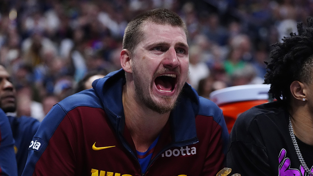 Denver Nuggets center Nikola Jokic (15) reacts from the bench in the third quarter against the LA Clippers during game seven of first round for the 2025 NBA Playoffs at Ball Arena.