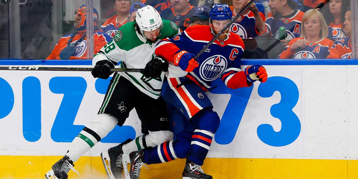 Dallas Stars defenseman Alexander Petrovic (28) checks Edmonton Oilers center Connor McDavid (97) during the third period in game three of the Western Conference Final of the 2025 Stanley Cup Playoffs at Rogers Place.