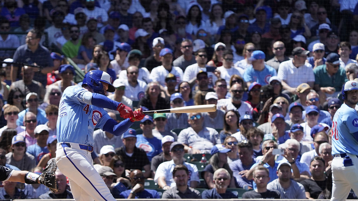 Chicago Cubs outfielder Pete Crow-Armstrong (4) hits a three run home run against the Chicago White Sox during the second inning at Wrigley Field.