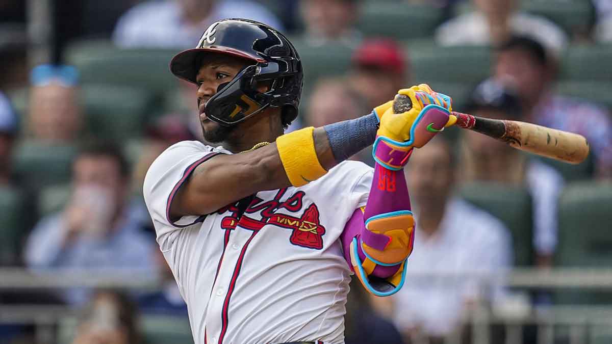 Atlanta Braves right fielder Ronald Acuna Jr (13) hits a double against the San Diego Padres during the fifth inning at Truist Park.