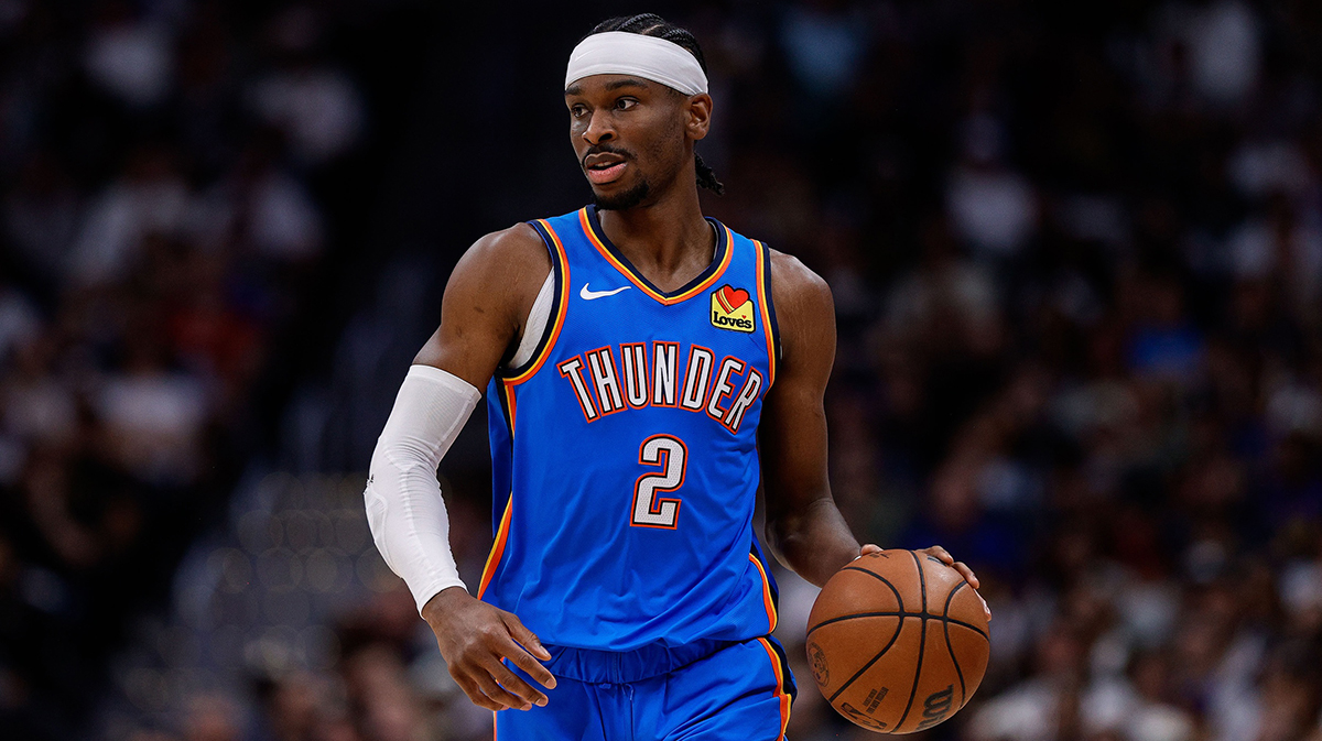Oklahoma City Thunder guard Shai Gilgeous-Alexander (2) controls the ball as Denver Nuggets guard Christian Braun (0) guards in the second quarter during game six of the second round for the 2025 NBA Playoffs at Ball Arena.