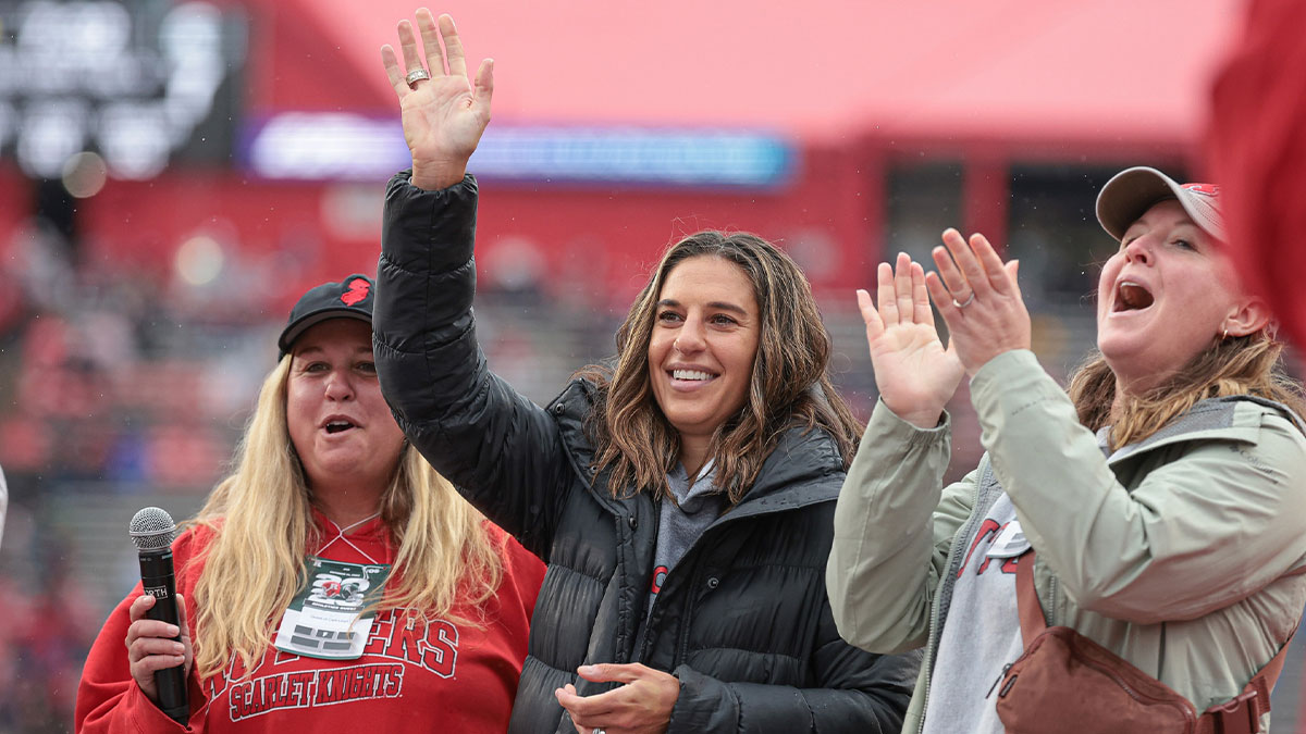 American soccer player and Rutgers Scarlet Knights alum Carli Lloyd (center) waves to fans during the first half of the game between the Scarlet Knights and the Michigan State Spartans at SHI Stadium.