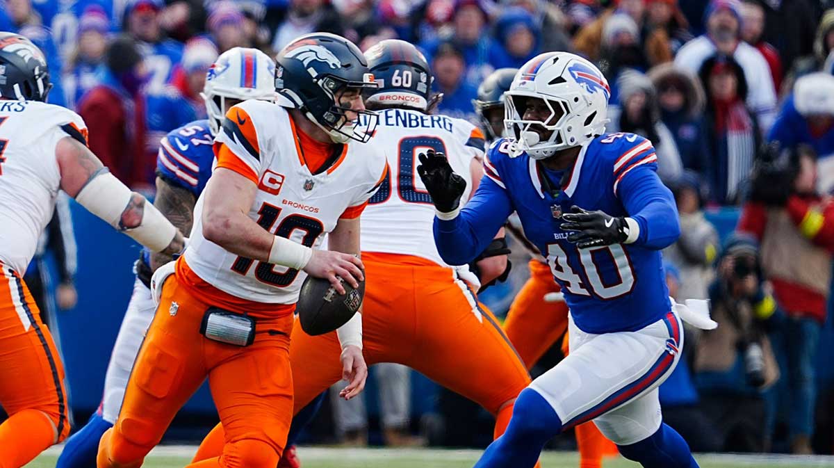Buffalo Bills linebacker Von Miller (40) rushes towards Denver Broncos quarterback Bo Nix (10) and misses tackling him during the second half of the Buffalo Bills wild card game against the Denver Broncos at Highmark Stadium in Orchard Park on Jan. 12, 2025.