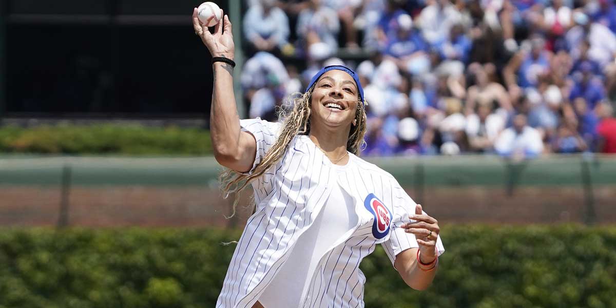 Former WNBA star Candace Parker Throws to a ceremonial first pitch before a game between the Chicago Cubs and the Cincinnati Reds at Wrigley Field.