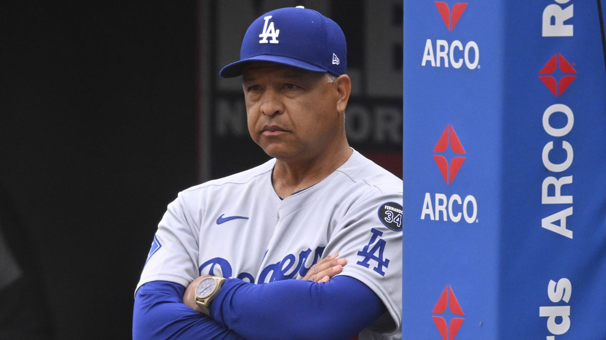  Los Angeles Dodgers manager Dave Roberts (30) stands in the dugout in the third inning against the Cleveland Guardians at Progressive Field.