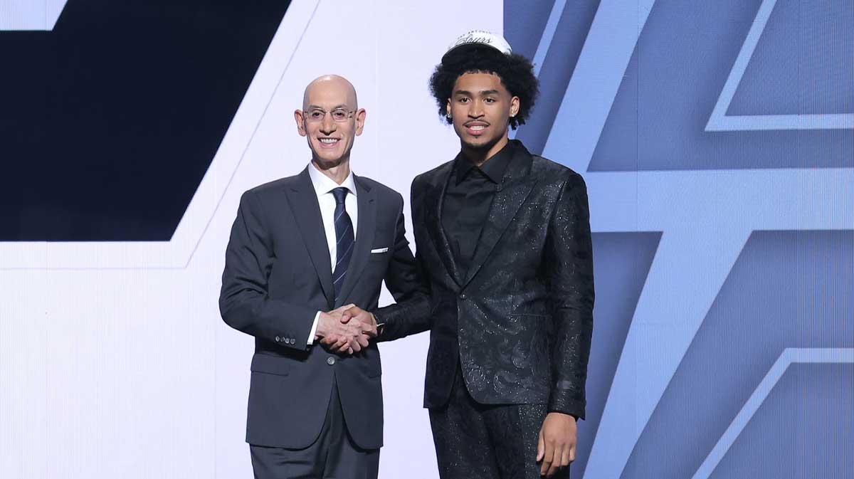 Dylan Harper stands with NBA commissioner Adam Silver after being selected as the second pick by the San Antonio Spurs in the first round of the 2025 NBA Draft at Barclays Center.