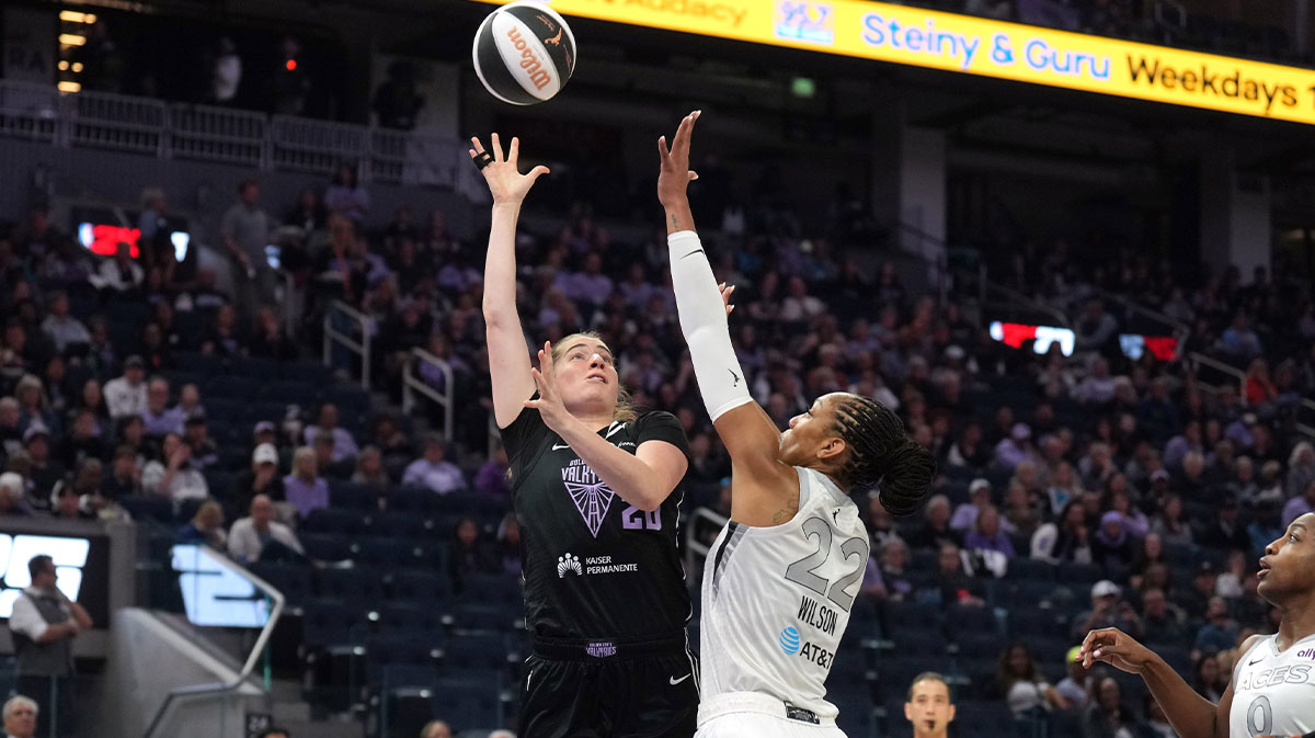 Golden State Valkyries guard Kate Martin (left) shoots against Las Vegas Aces center A'ja Wilson (22) during the first quarter at Chase Center.
