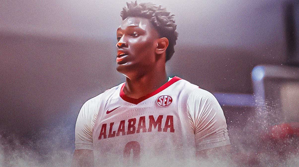 High school basketball player Collins Onyejiaka in an Alabama Crimson Tide basketball jersey, recruit reclassify