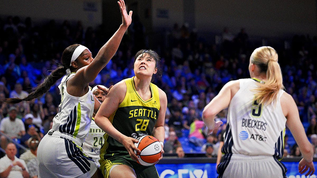 Dallas Wings forward Myisha Hines-Allen (2) and guard Paige Bueckers (5) and Seattle Storm center Li Yueru (28) in action during the game between the Dallas Wings and the Seattle Storm at College Park Center.