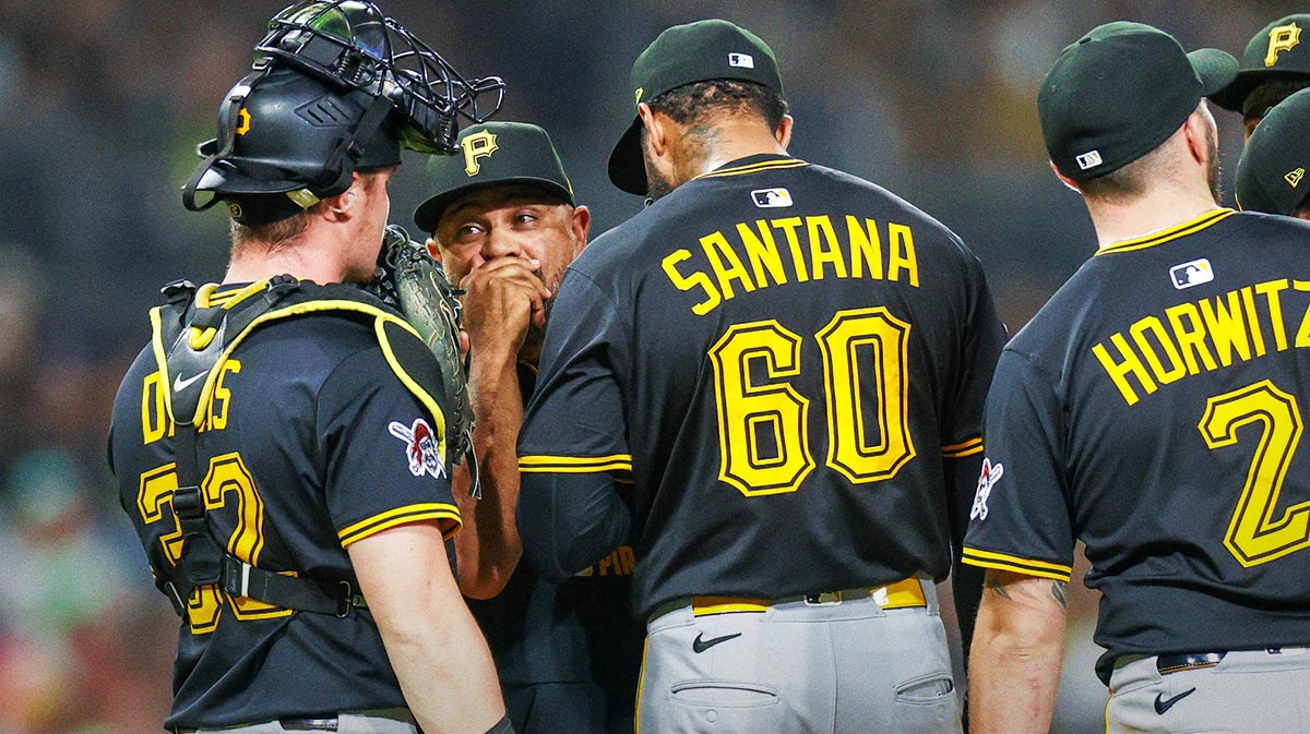 Pittsburgh Pirates pitching coach Oscar Marin (47) meets with Pittsburgh Pirates relief pitcher Dennis Santana (60) during the eighth inning at Petco Park.
