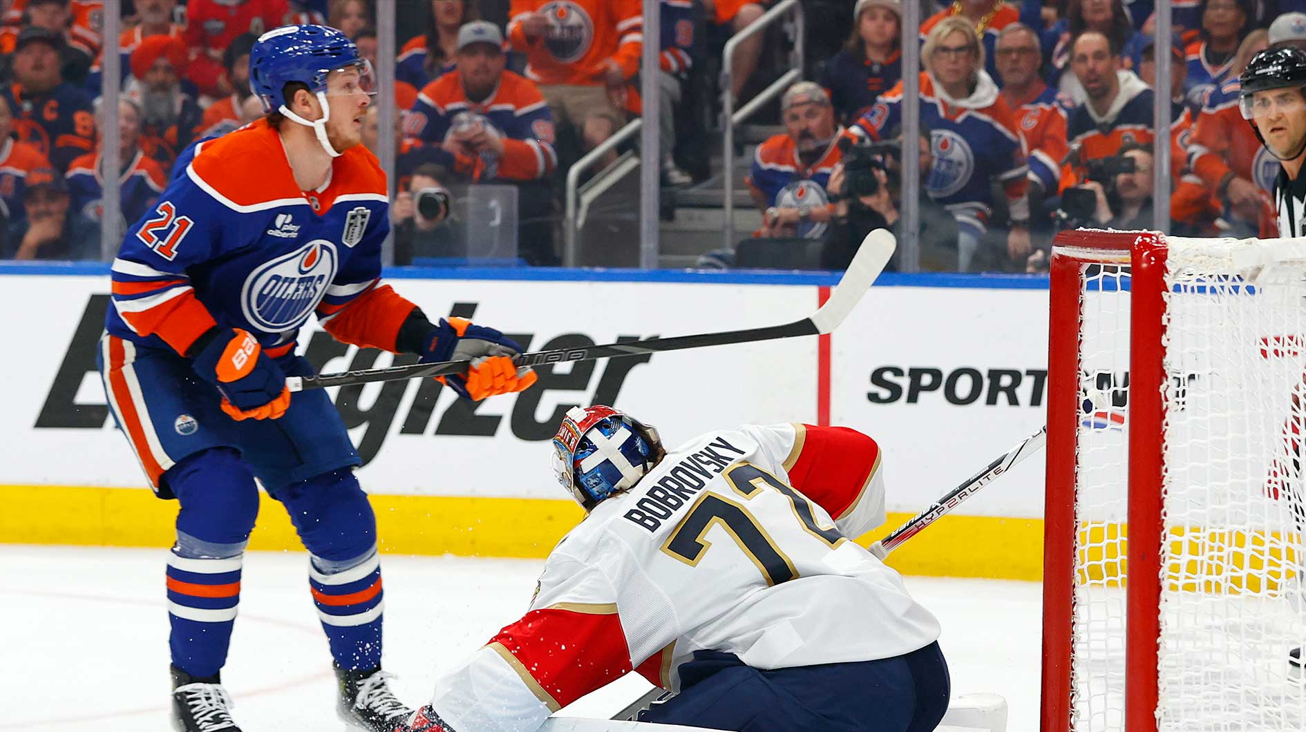 Edmonton Oilers center Trent Frederic (21) shoots the puck on Florida Panthers goaltender Sergei Bobrovsky (72) during the first period in game two of the 2025 Stanley Cup Final at Rogers Place.