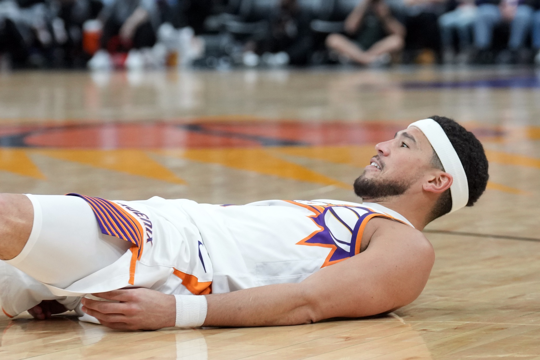 Phoenix Suns guard Devin Booker (1) reacts after making a basket and being fouled against the San Antonio Spurs during the second half at Footprint Center.
