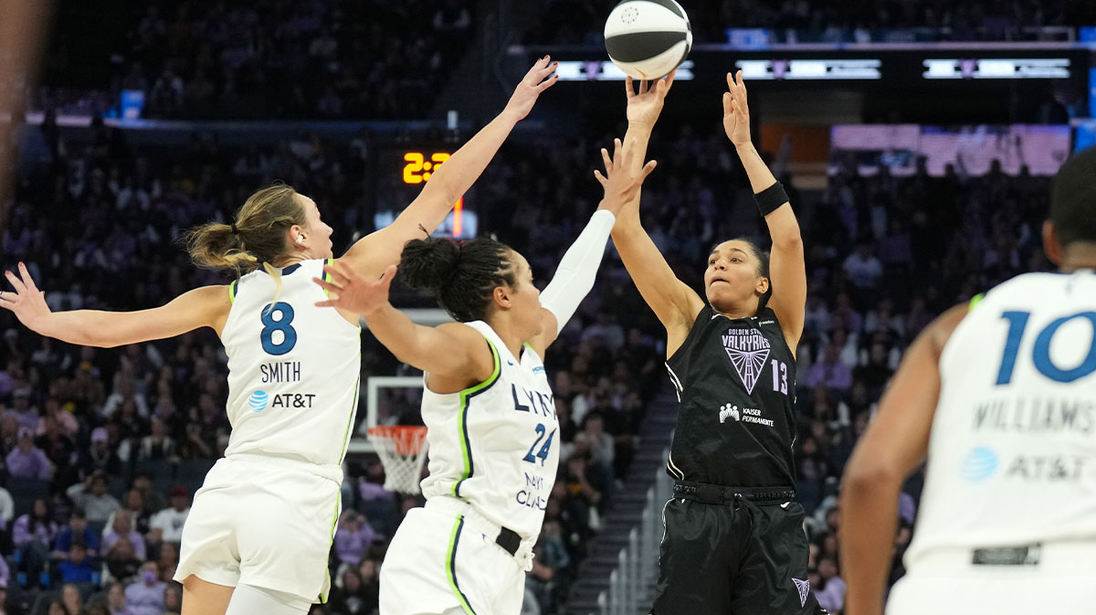 Golden State Valkyries forward Janelle Salaun (13) shoots against Minnesota Lynx forward Alanna Smith (8) and forward Napheesa Collier (24) during the fourth quarter at Chase Center.